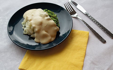 Food On Plate With Cultery On Table