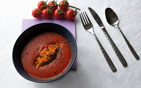 Food In Bowl On Table With Cutlery