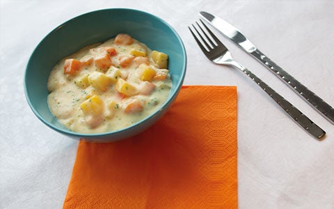 Food In Bowl On Table With Cutlery